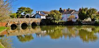 View over the water of Town Bridge and houses