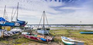 Boats on the beach at Mersea Island when the tide is out