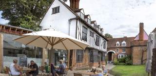 Tymperley's tea room with people sitting outside