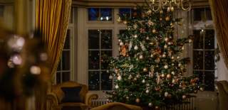 The Greenway at Christmas - a lit Christmas tree in front of an ornate bay window