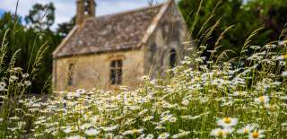 Churchill & Sarsden Heritage Centre with flowers in the foreground