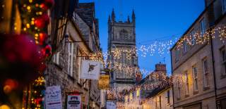 Festoon lighting and shop signs in Cirencester