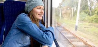 Woman on a train looking out of the window