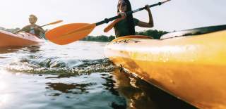 a couple in yellow kayaks