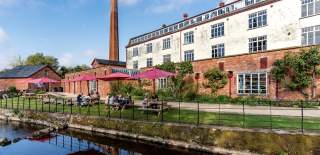 The image shows Coldharbour Mill, located in Uffculme, Devon, England