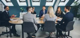 A group of colleagues having an event planning meeting