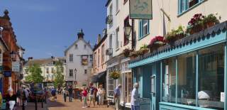 sidmouth high street with some people walking about