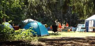 a series of tents in a campsite