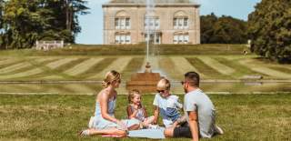 A family enjoying a picnic in the grounds of Sledmere House in East Yorkshire