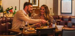 A couple enjoying a meal at The Pig and Whistle in Beverley, East Yorkshire