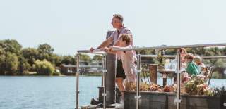 A family enjoying the view over the lake at Bert's restaurant in Brandesburton, East Yorkshire