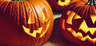 Two illuminated Halloween pumpkins