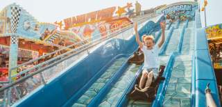 Children going down slides at Bridlington Funfair