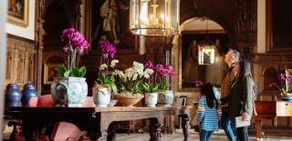 A family exploring the grand hall at Burton Agnes Hall in East Yorkshire