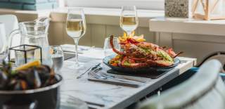 A plate of beautifully presented lobster alongside a pot of mussels ready to enjoy at Salt on the Harbour in Bridlington
