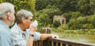 A couple enjoying a coffee overlooking Folly Lake