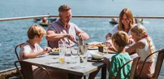 A family enjoying a meal together outside at Berts in Brandesburton.