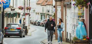 A couple walking through Bridlington's Georgian Old Town.