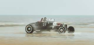 a car racing along Bridlington beach for Race the Waves