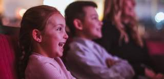 a family enjoying a show at Bridlington Spa