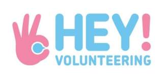 The Hey volunteering logo in blue and pink lettering. A hand symbol in pink is at the left side.