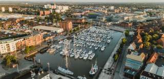 Hull Marina shot from above, showing many boats in the dock at sunset.
