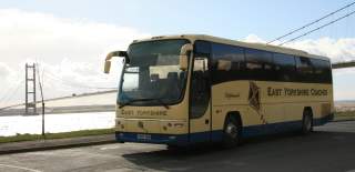 East Yorkshire Coaches bus parked near the Humber Bridge, Hull with riverside views.