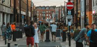A crowd of people stand down Humber Street during the Sesh.