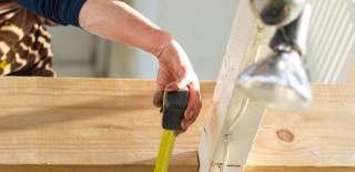 builder measuring in house