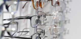 glasses on rack at opticians