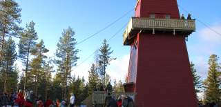 Lots of people outside the Hawks' Tower, reminiscent of the Moomin Tower