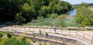 A grandparent and grandchild on a bridge at Hilsea Lines