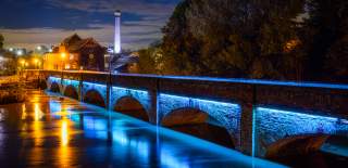 The Clopton Bridge in Stratford-upon-Avon, lit up at night