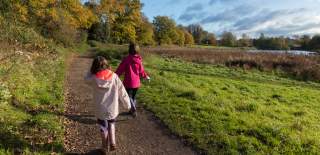 Two children walking in Abbey Fields, Kenilworth