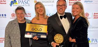 Four people holding an award for VisitEngland Best Large Hotel of the Year 2025 and smiling at the camera.