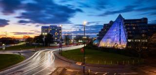 Nightime view of The Leonardo Royal Hotel and the new VoCo hotel