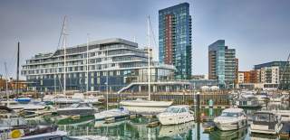 Ocean Village marina showing boats in the foreground and Harbour Hotel in the background which is designed as a super yatch