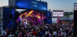 Performance on stage in front of crowd of people at the Southampton International Boat Show