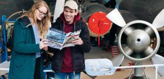 Two visitors enjoying Solent Sky Museum in Southampton