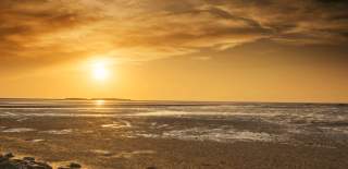 A sunset on a beach in Wirral