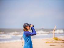 Birder at Rutherford Beach Creole Nature Trail