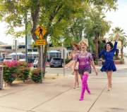 Three drag queens walking on Arenas Road in Palm Springs