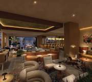 Luxuriously designed interior of a spacious lounge with dim ambient lighting, featuring a mix of modern and retro furniture, decorative rugs, and a bar area in the background, complemented by wall art depicting a vintage car. Thompson
