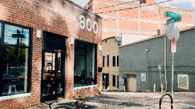 A bicycle rests outside the main entrance to Remedy Coffee in Knoxville, TN.