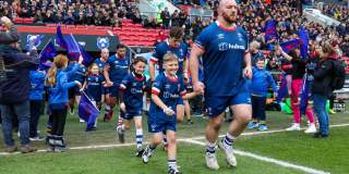 Bristol Bears Rugby players with children mascots