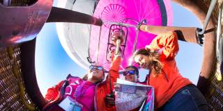 A group of people in a balloon basket at Bristol International Balloon Fiesta - credit Paul Box