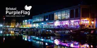 Bristol Harbourside at night with Purple Flag logo - credit Matthew Alden