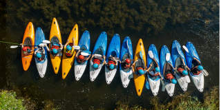 A group of people kayaking at Mendip Activity Centre, near Bristol - credit Mendip Activity Centre