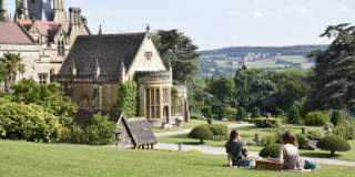Two women eating a picnic in the grounds of Tyntesfield House, near Bristol - credit Alana Wright