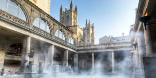 An wide shot of the Great Bath at The Roman Baths in central Bath, near Bristol